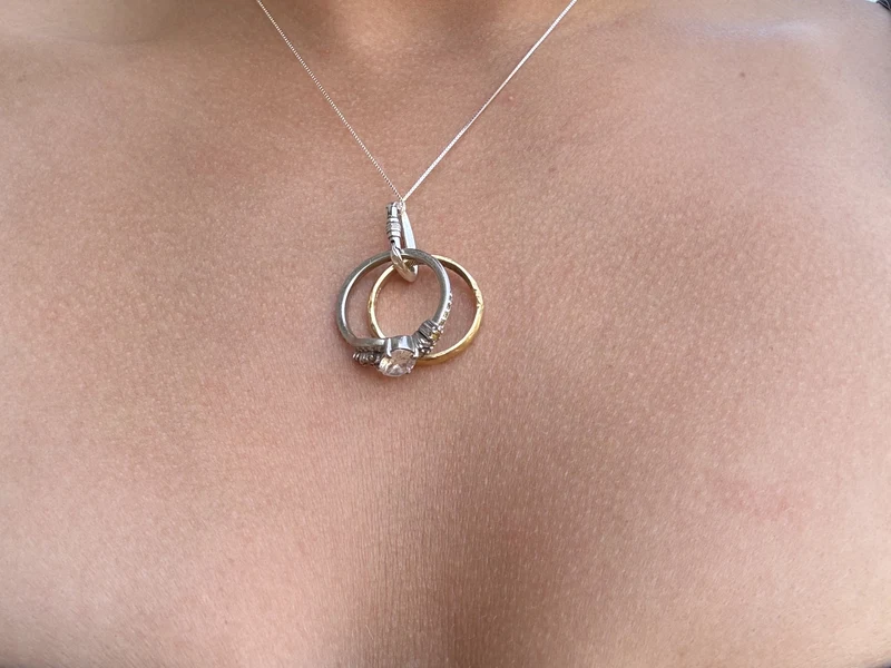 Carabiner necklace with rings clipped on
