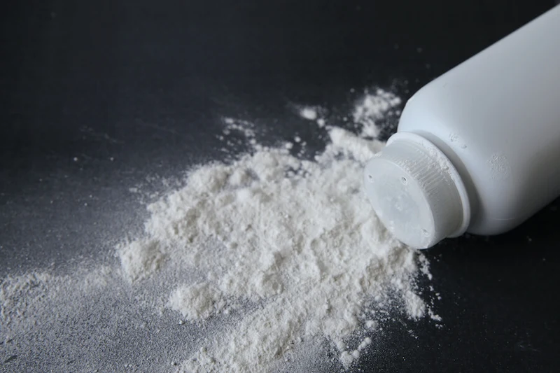 Talcum powder spilling from bottle